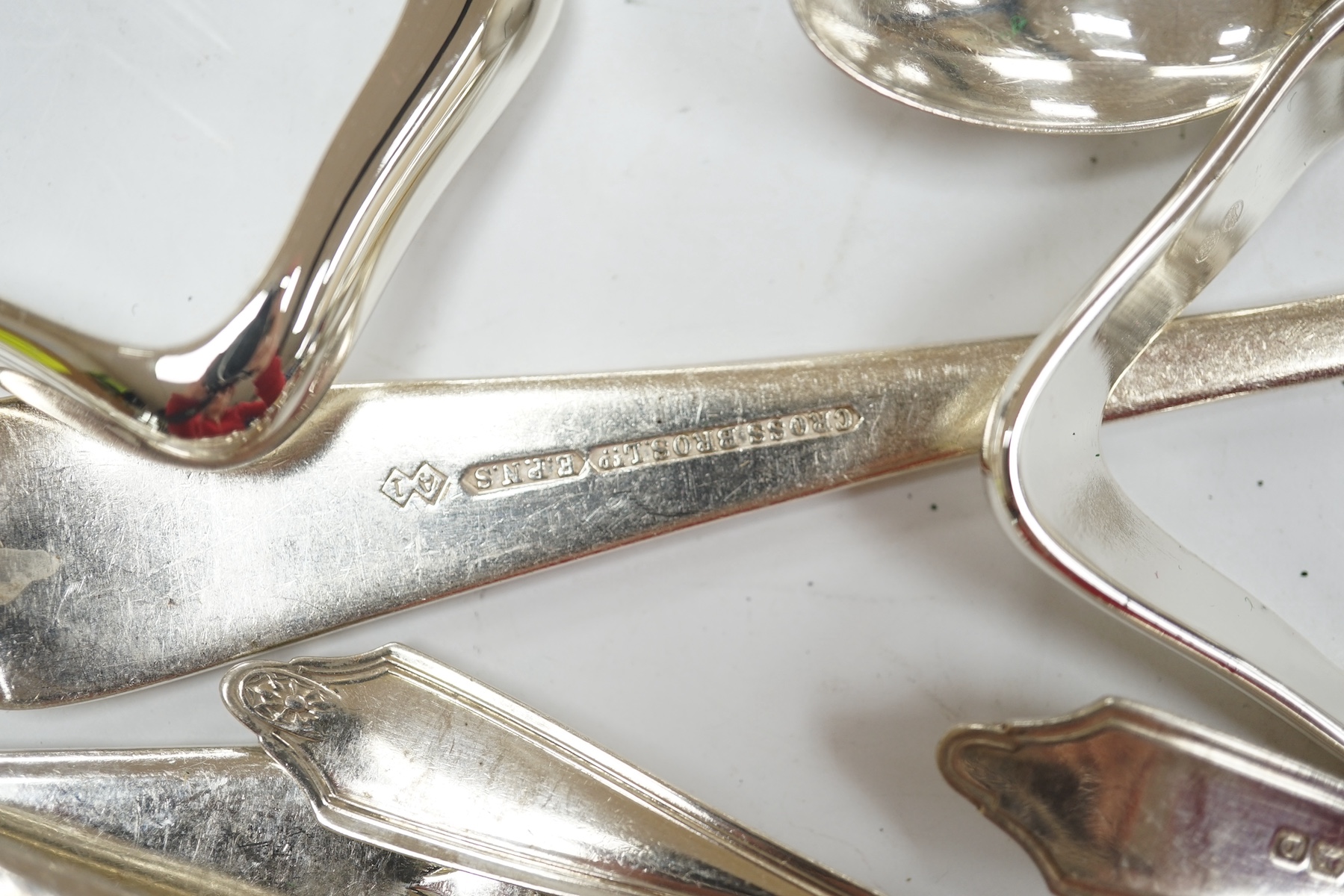 A William IV provincial silver fiddle pattern sauce ladle, John Langdon, Exeter, 1833, together with a set of six later silver coffee spoons, 4.9oz, together with a quantity of assorted plated flatware. Condition - fair